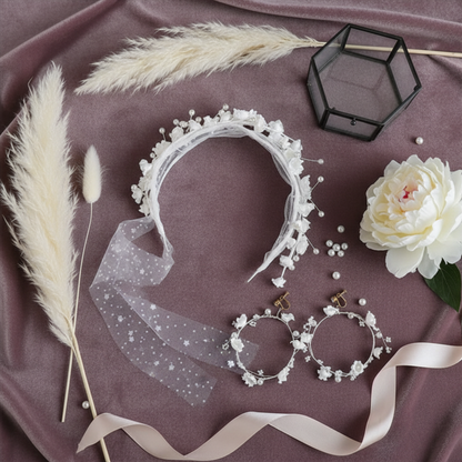 Flower crown headband and hoop earrings flat lay with pampas grass
