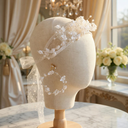 White flower crown headband on mannequin head with marble background