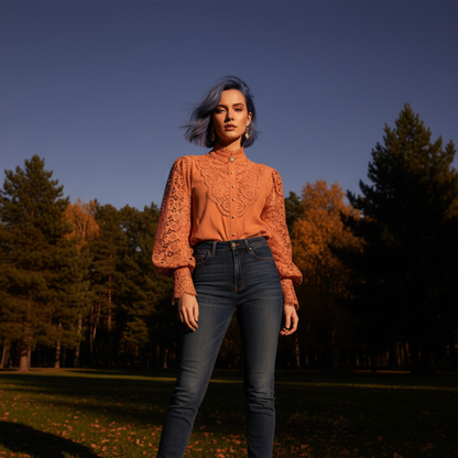 Woman wearing orange crochet lace blouse in field at night