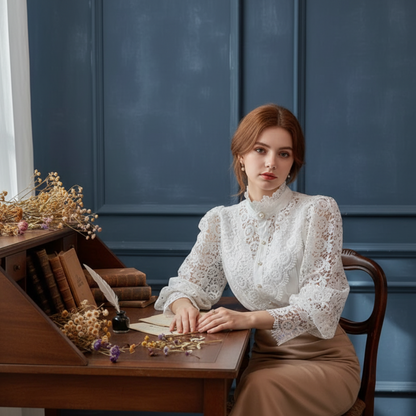 Woman wearing white crochet lace blouse at wooden desk