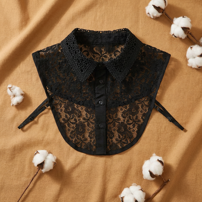 Black lace detachable collar flat lay on tan cotton fabric