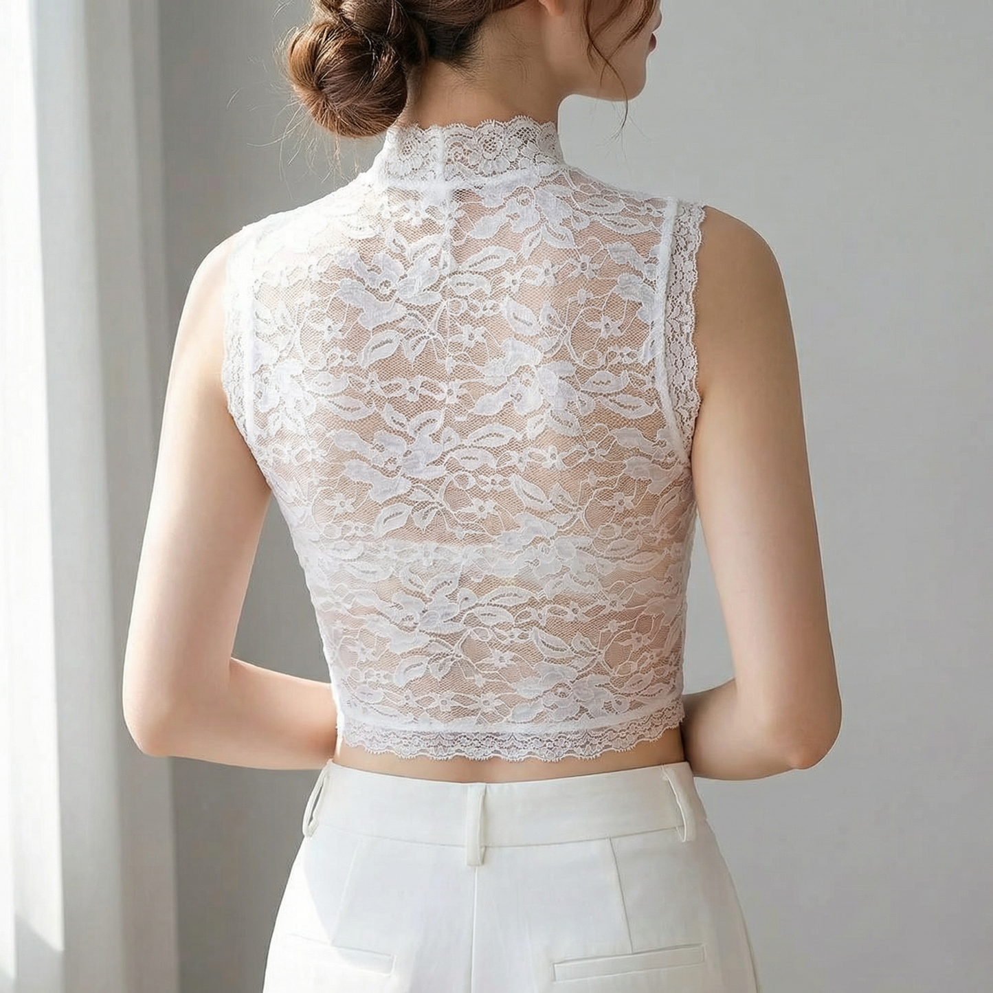 Back view of white floral lace crop top