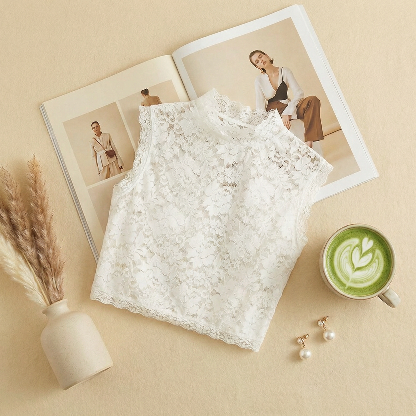 White floral lace crop top flat lay with fashion magazine