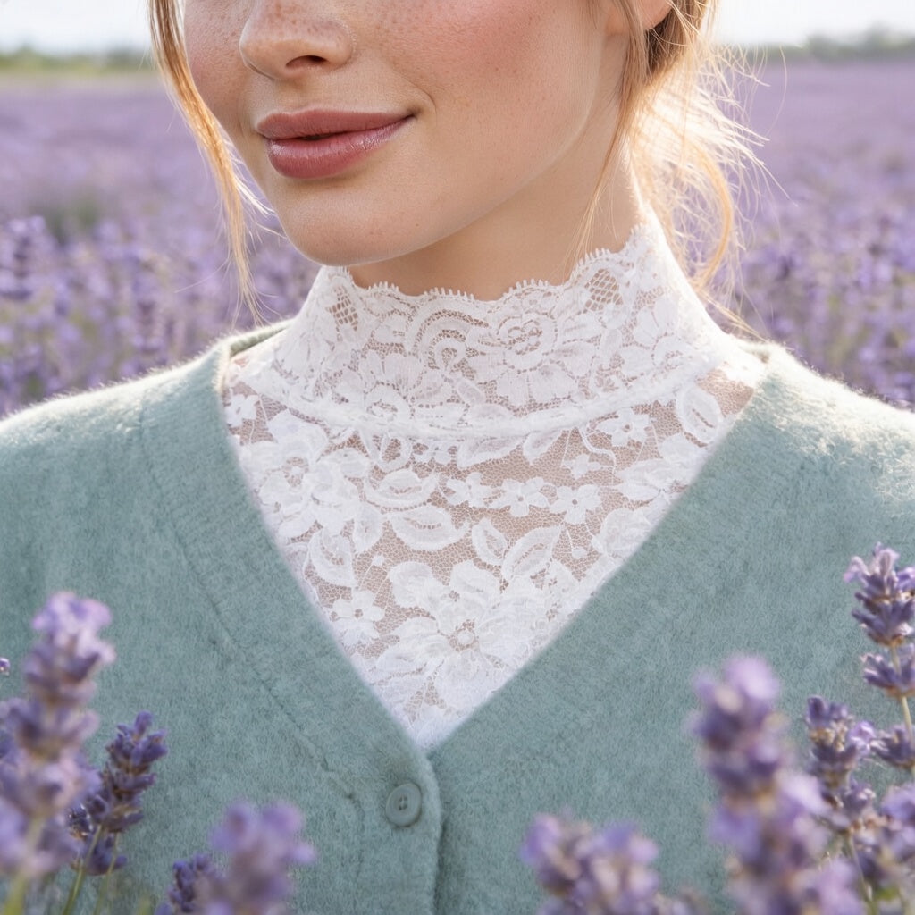 Woman wearing white lace crop top in a lavender field