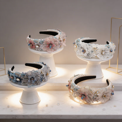 Floral lace headbands in pink, white, blue, and yellow, flat lay