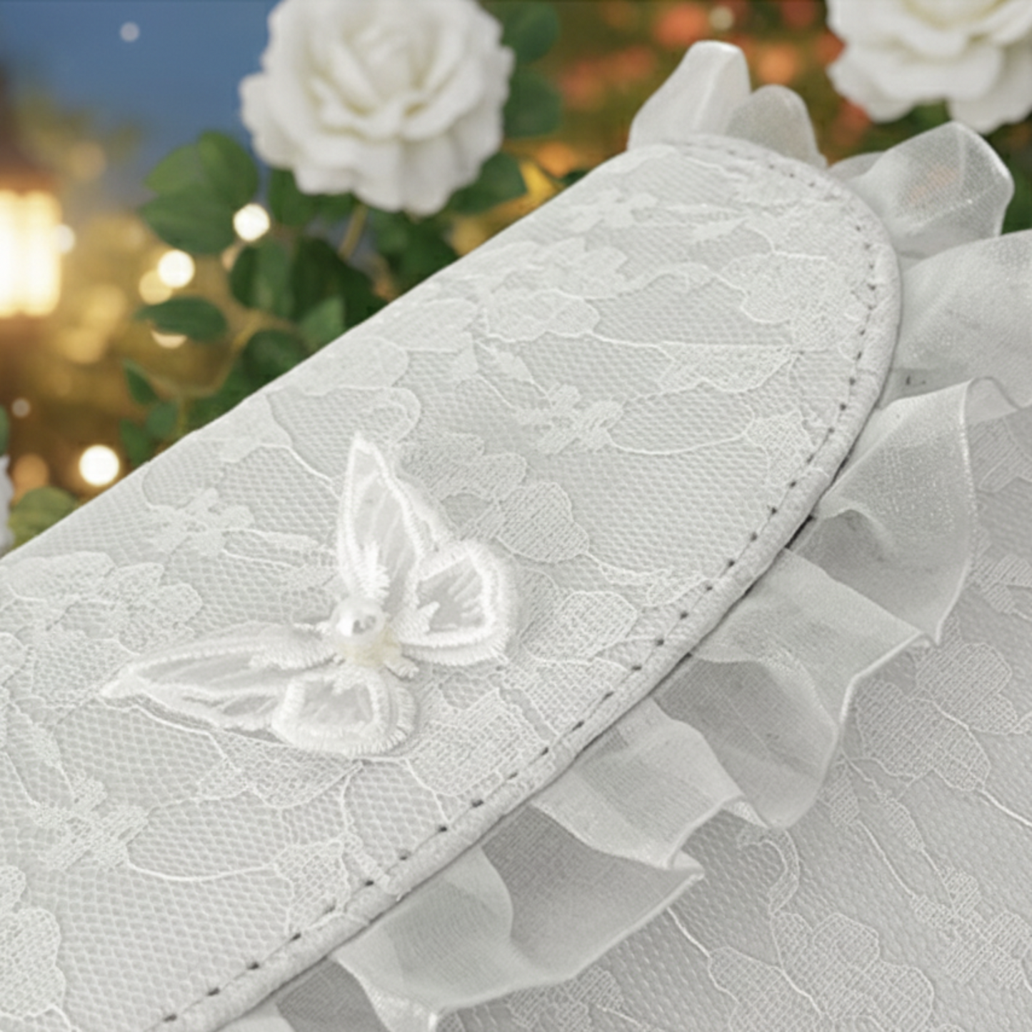 Close-up of white lace crossbody bag ruffle trim with rose