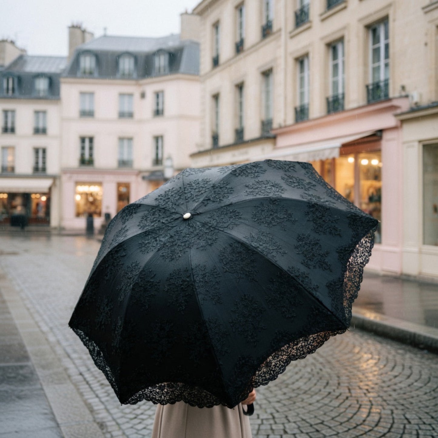 Black lace embroidery umbrella on rainy city street