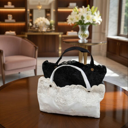 Black and white lace embroidery umbrellas on table indoors