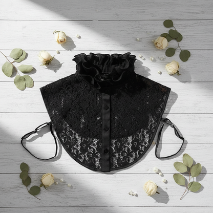 Black lace ruffle collar flat lay with eucalyptus sprig