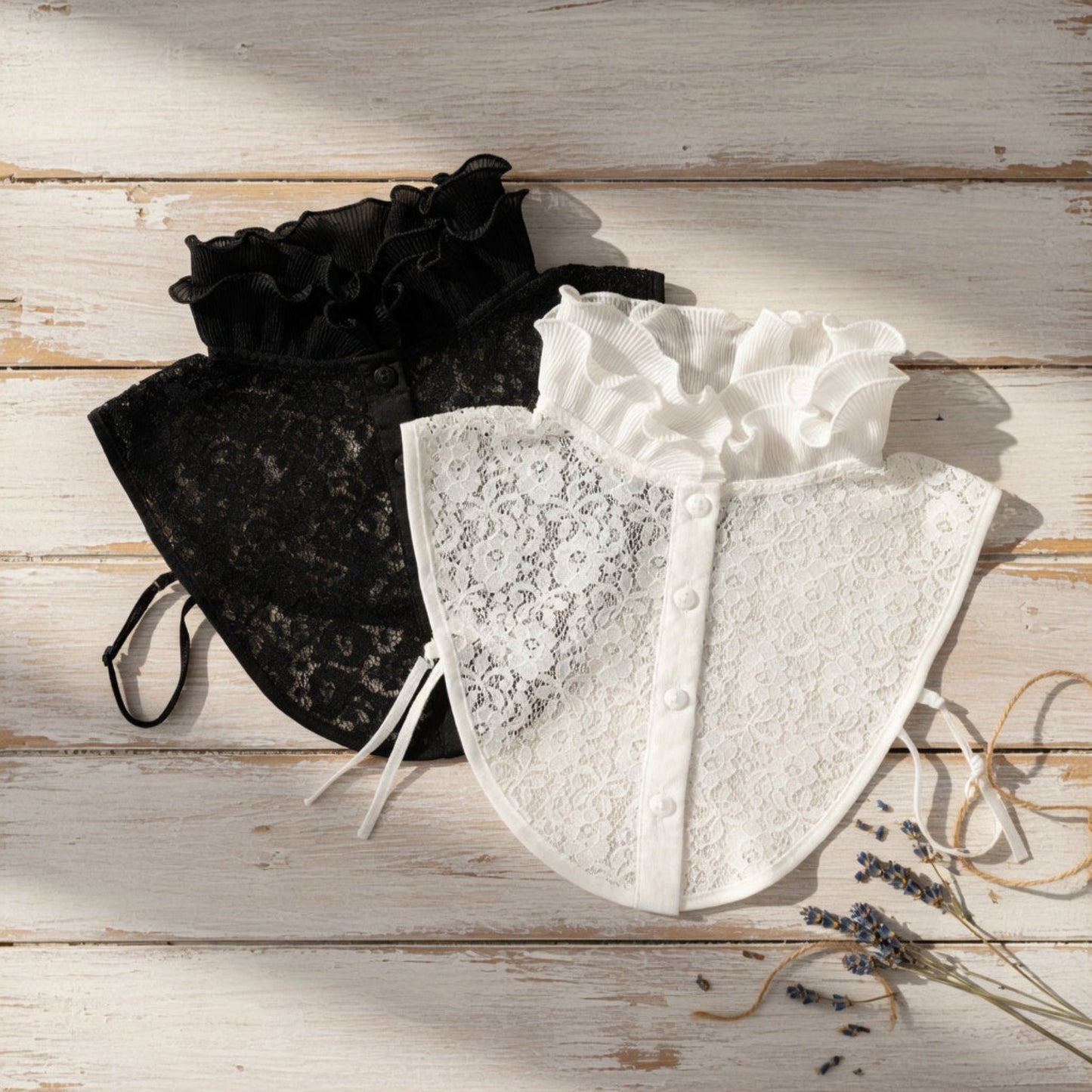 Black and white lace ruffle collars on mannequins side by side