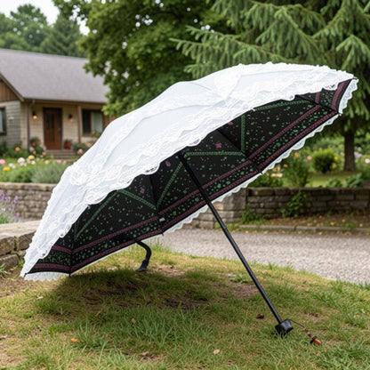 White lace ruffle parasol open in green field, top view