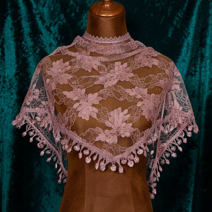 Dusty rose lace triangle scarf on mannequin with teal velvet background