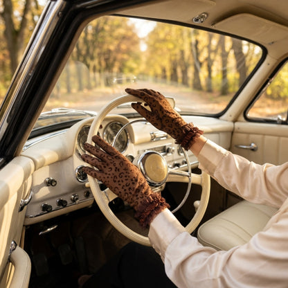 Nude leopard print lace gloves worn while driving a car