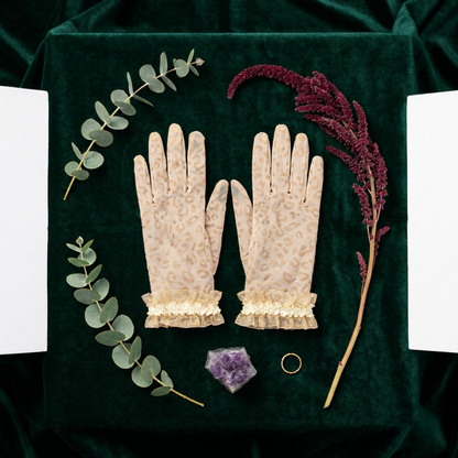 Nude leopard print lace gloves flat lay with eucalyptus sprig