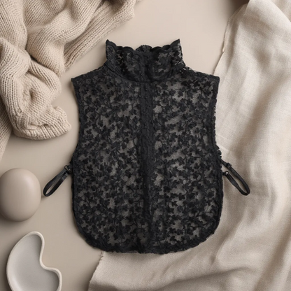 Black floral lace Peter Pan collar flat lay on satin fabric