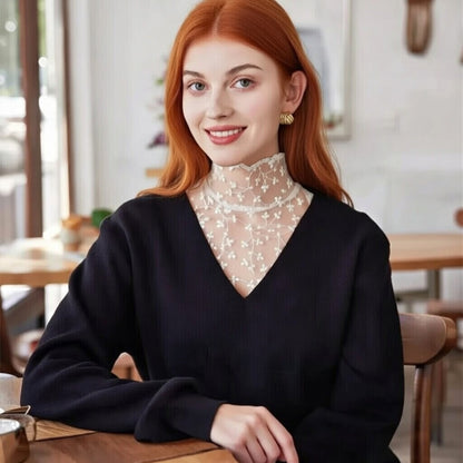 Woman wearing black lace Peter Pan collar with navy blouse at cafe