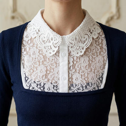 Woman wearing white lace Peter Pan collar with navy dress