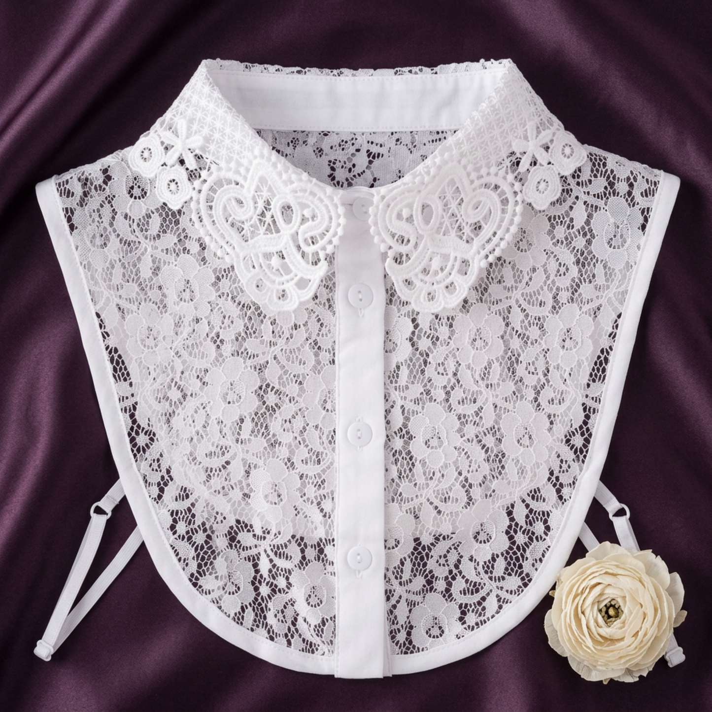 White lace Peter Pan collar flat lay on purple velvet fabric
