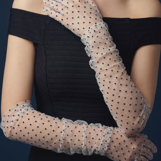White lace gloves with black polka dot  worn with off-shoulder evening dress