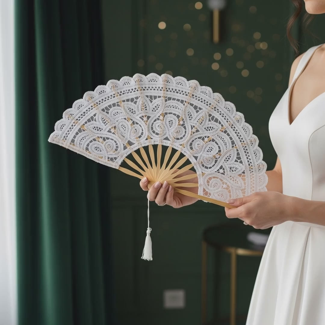 Video of white lace hand fan opening and closing