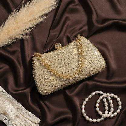 Gold rhinestone crystal clutch with feather and pearl bracelets