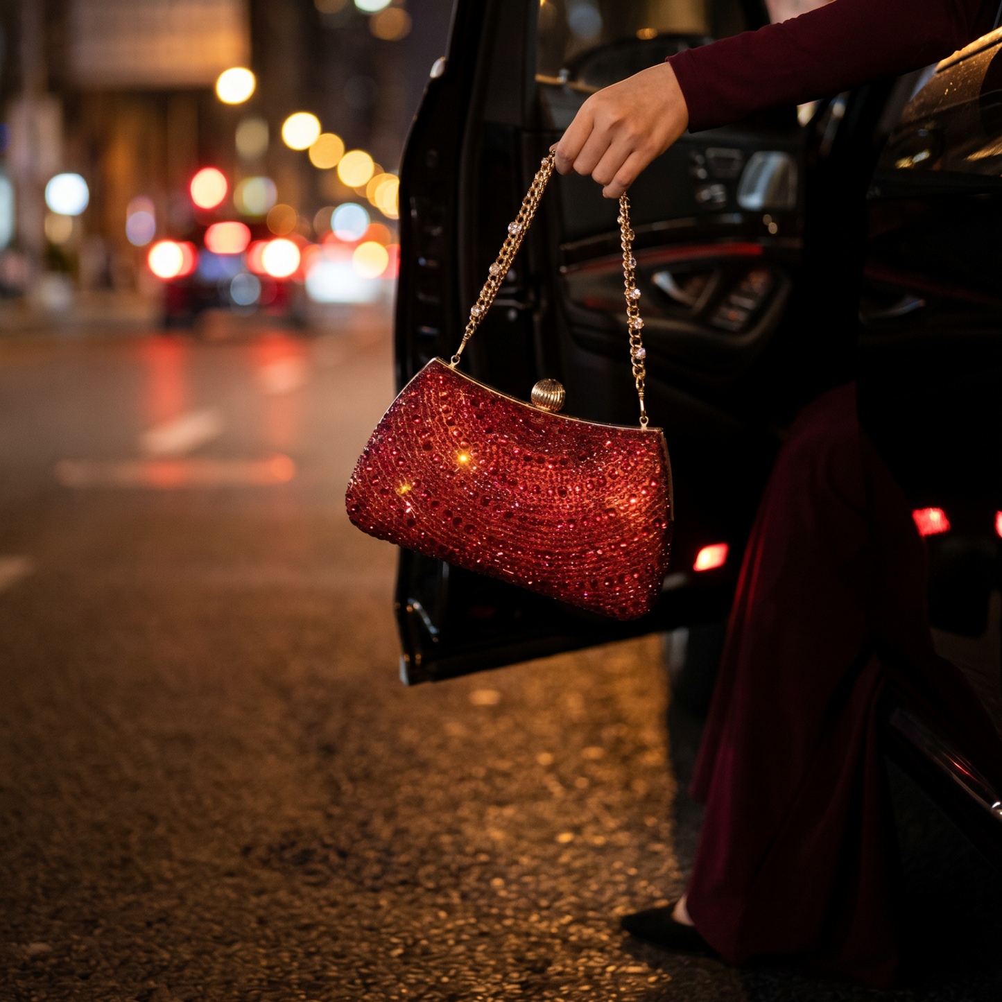 Woman carrying red rhinestone crystal clutch on night street
