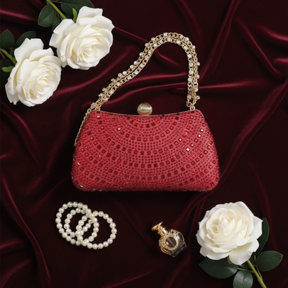Red rhinestone crystal clutch with pearls and white roses on velvet