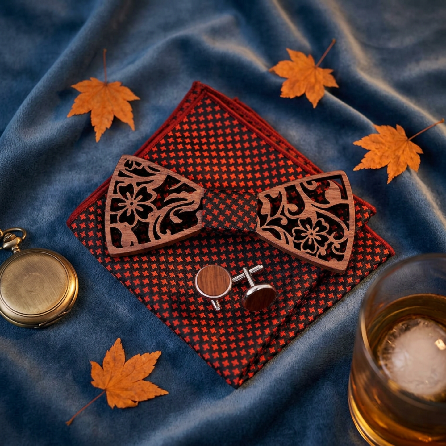 Walnut floral bow tie flat lay on blue fabric with autumn leaves