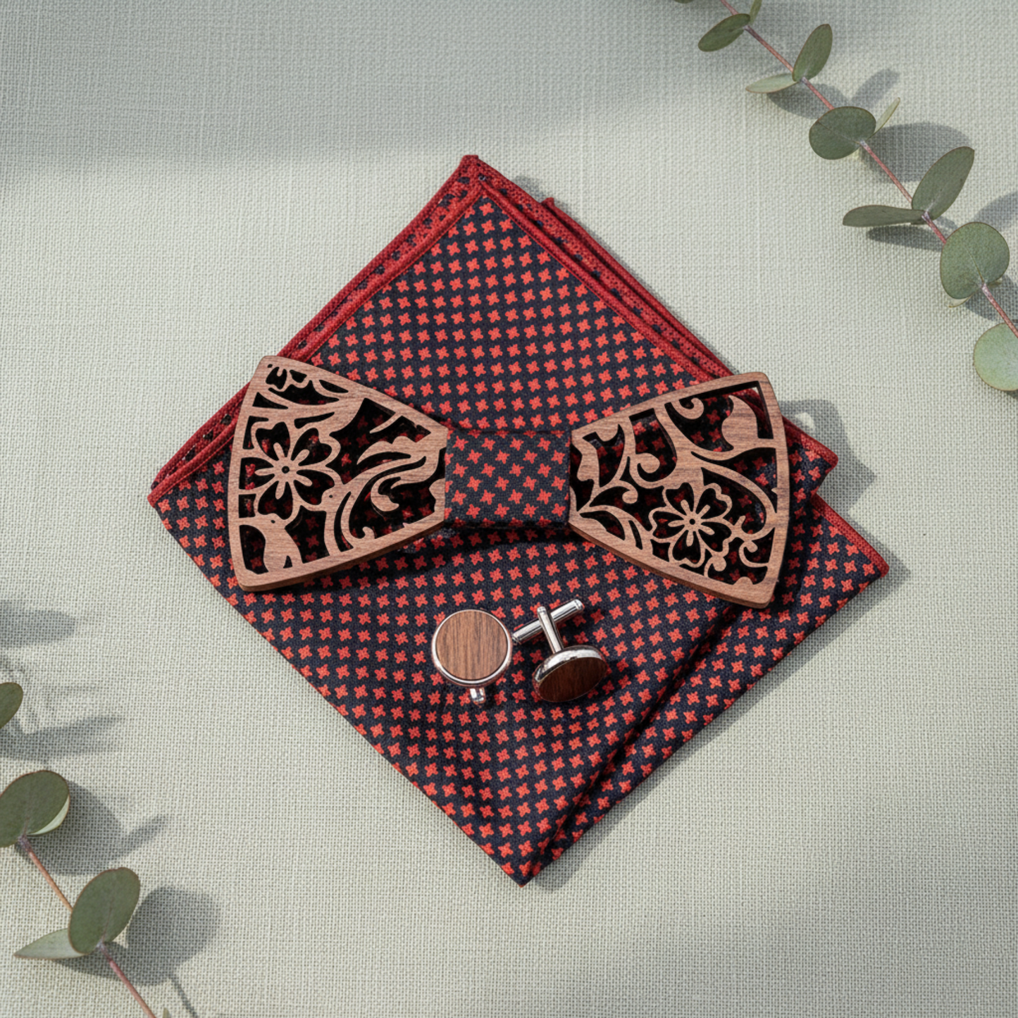 Walnut bow tie gift set flat lay with eucalyptus sprigs